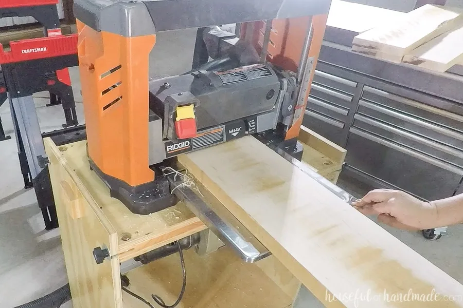 Using a Ridgid brand planer to plane the boards to final thickness.