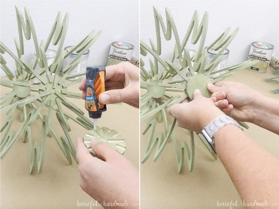 Two pictures showing adding the second disc to the bottom of the Christmas tree. 