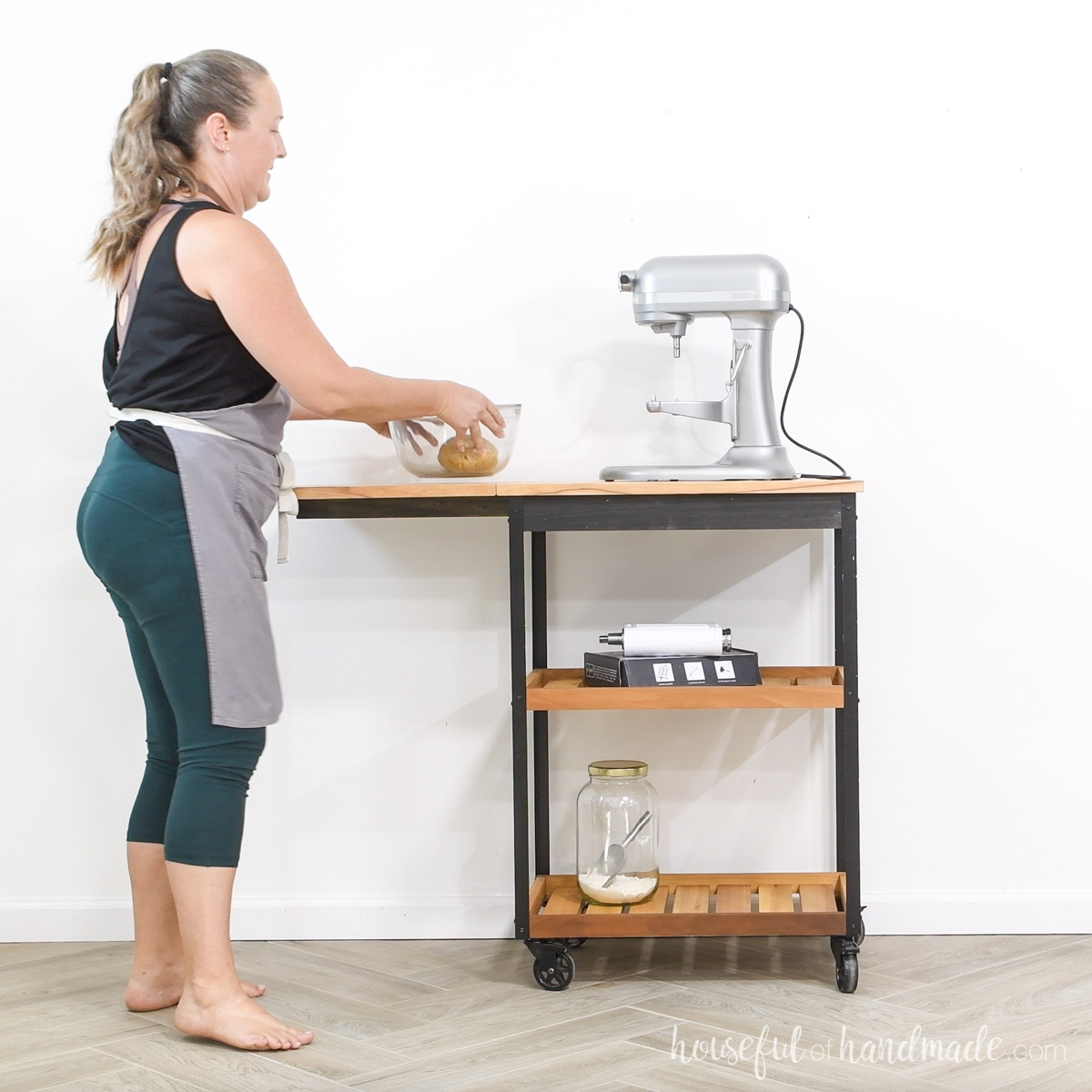 Kati using the kitchen cart with the leaf raised.