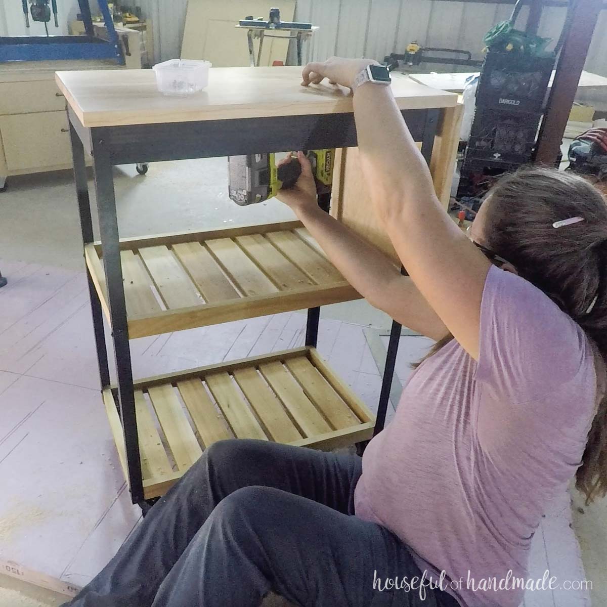 Attaching the top to the cart with figure 8 fasteners. 