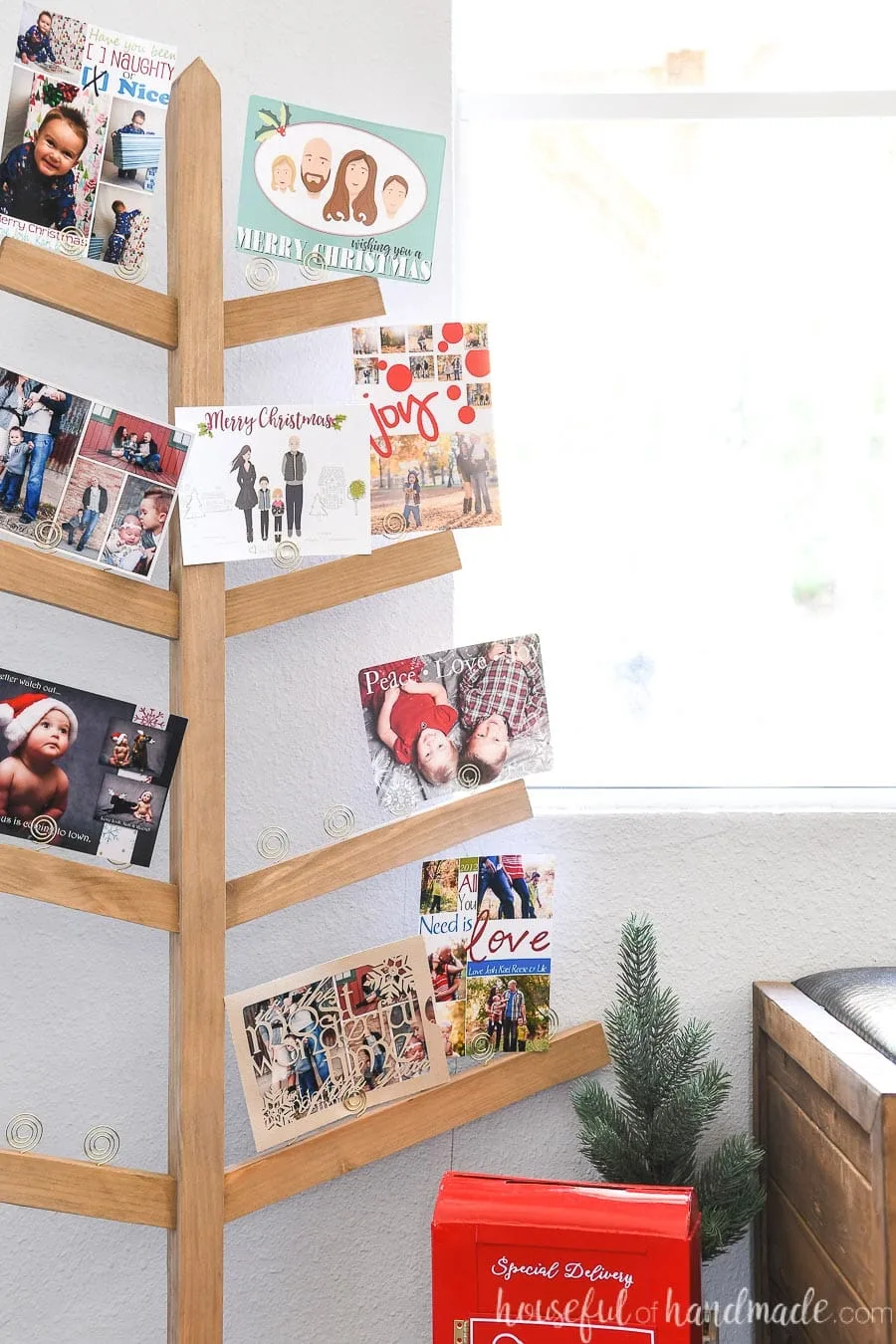 Close up of the family Christmas cards displayed in the DIY Christmas card holder. 