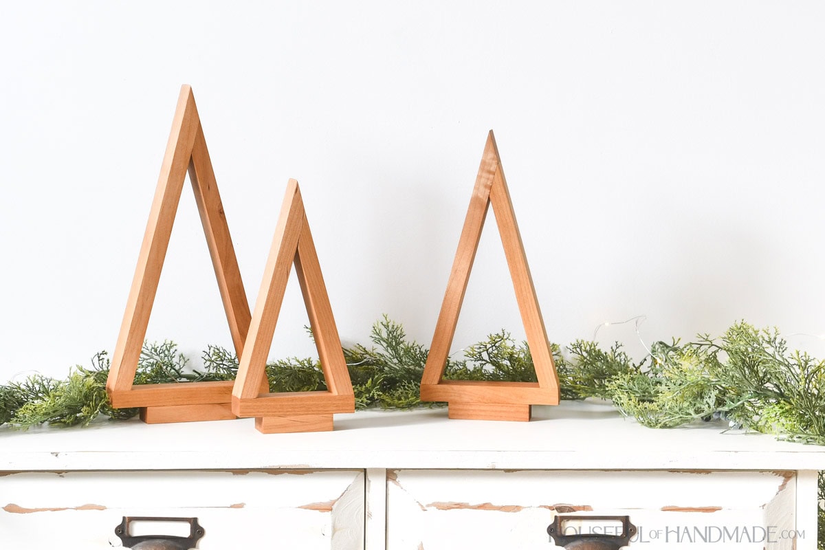 Three different sized tabletop Christmas trees made from Alder wood.  