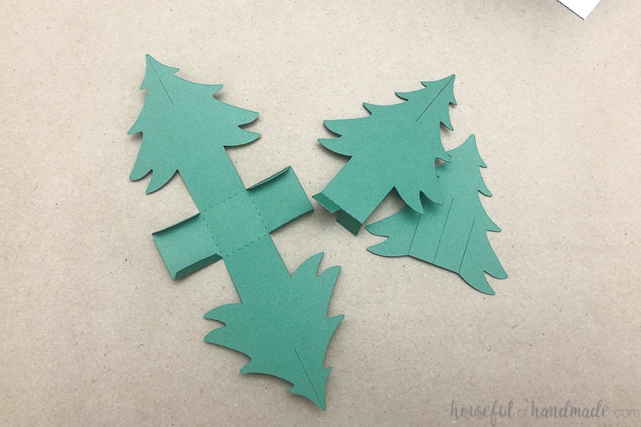 All the pieces of the paper Christmas tree folded along the dotted lines. 