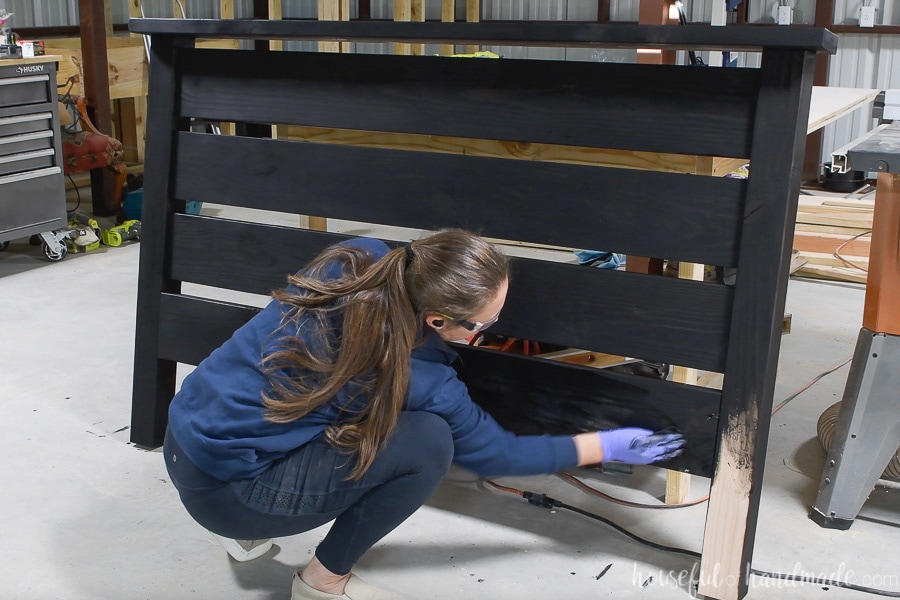 Staining the headboard with True Black wood stain. 