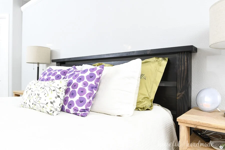Close up of the easy to build headboard as part of the queen DIY bed tutorial.