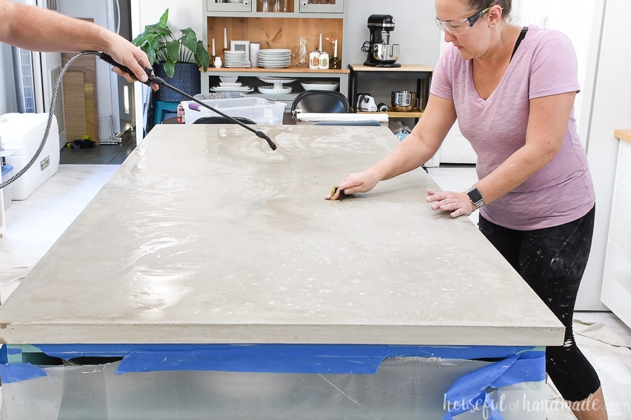 Sanding the concrete by hand for the kitchen countertop. 