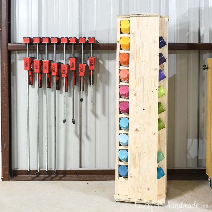 Wood shop with a spray paint storage cabinet in the corner that rotates and holds 40 cans of spray paint.