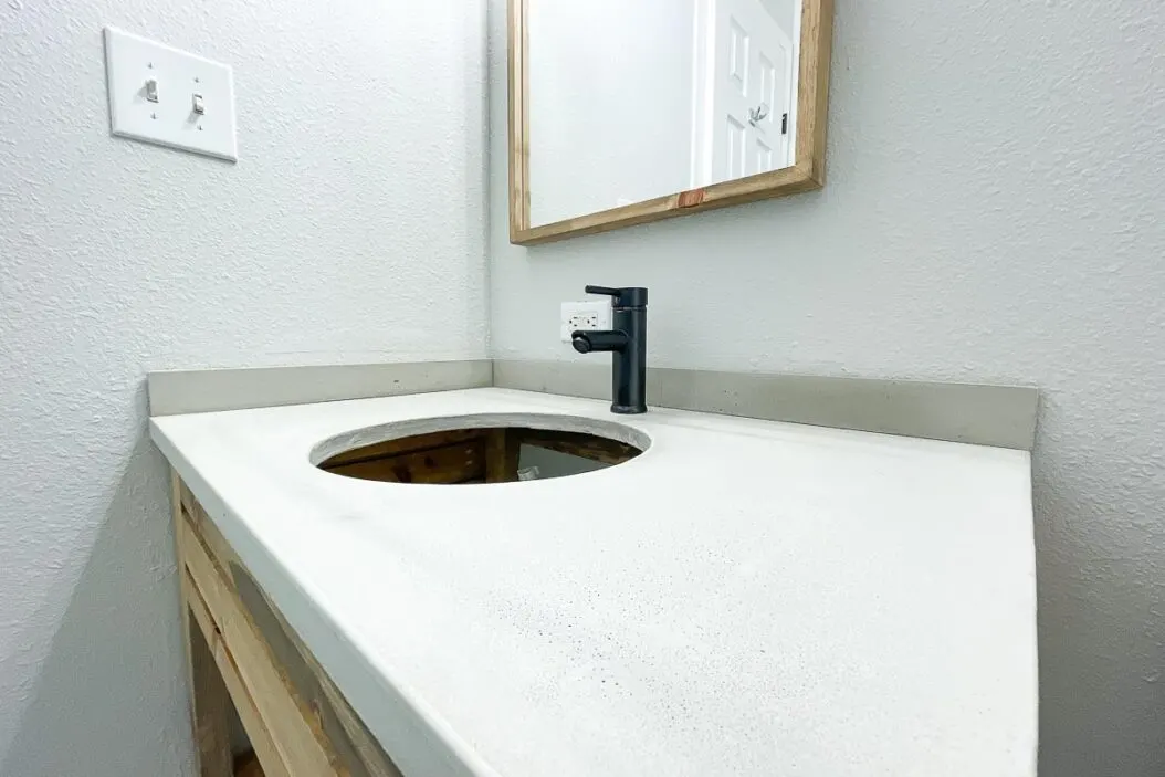 Close up of the DIY concrete vanity top in the bathroom remodel.