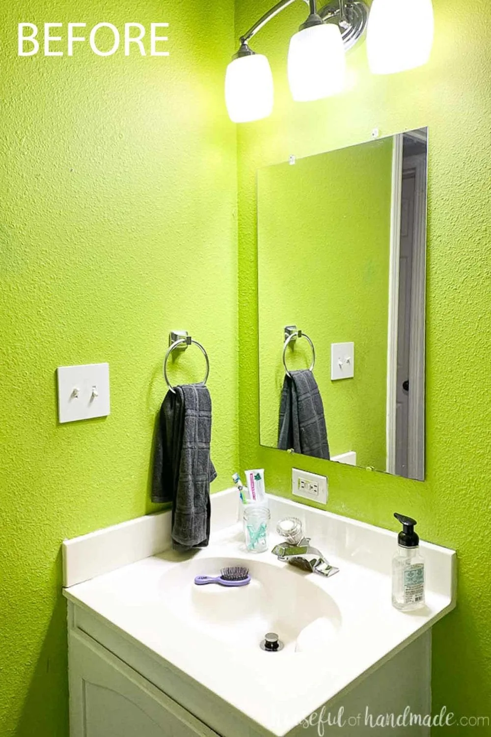 Before photo of the bathroom vanity top with a plain mirror on the wall.