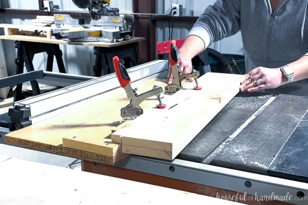 Cutting a tapered for the bathroom vanity legs on a table saw with a homemade tapered leg jig.