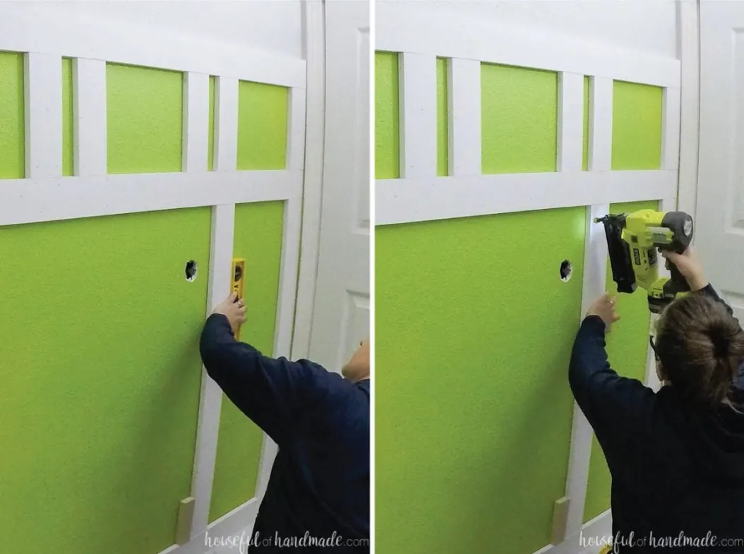 Leveling and attaching the larger vertical boards to the wall.