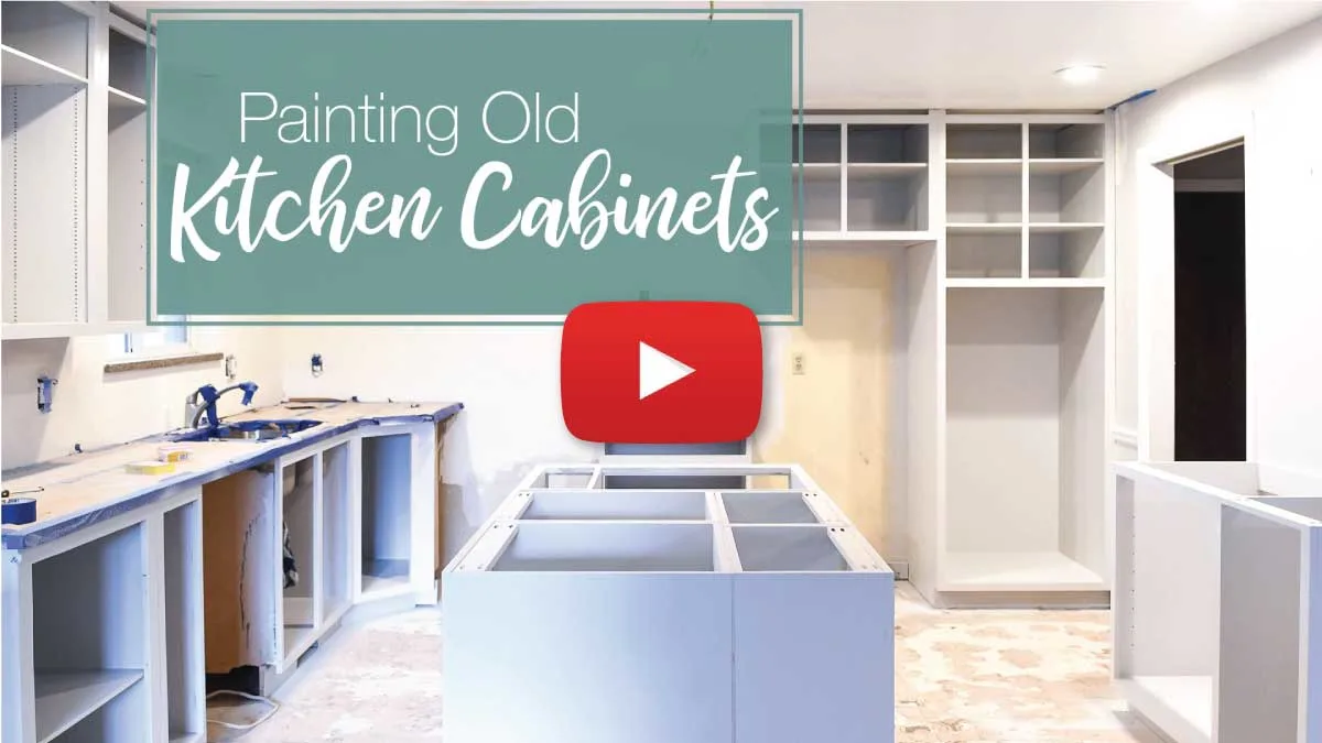 Kitchen cabinet video tutorial thumbnail with play button on top. 