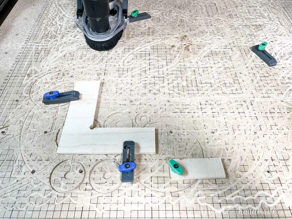 X-Carve waste board with a corner stop attached to it to create a repeatable carve. 