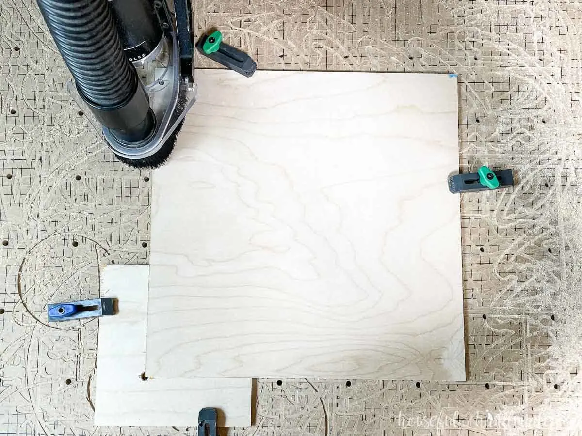 One of the plywood tiles clamped onto the X-carve waste board. 