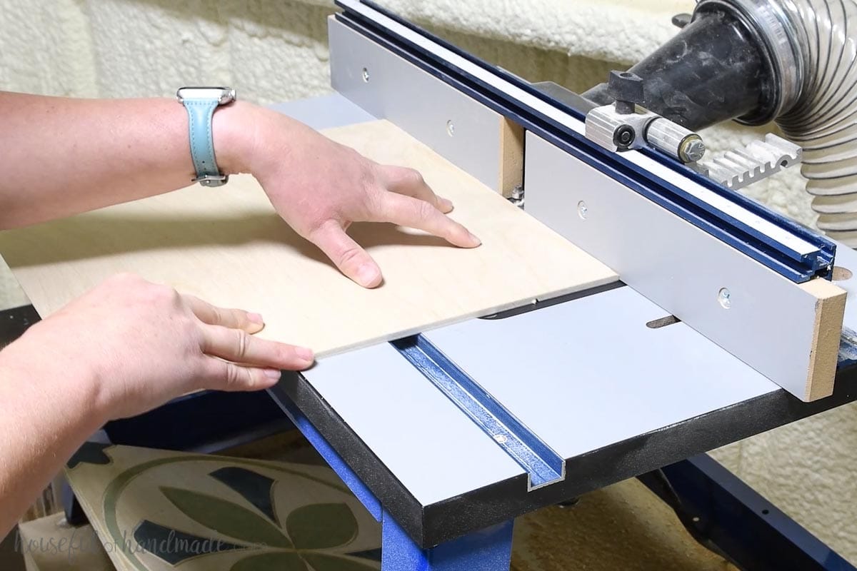 Routing a chamfer on the edges of the wood tile. 