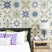 Bedroom accent wall made of carved wood tiles with patterned tile designs on it.