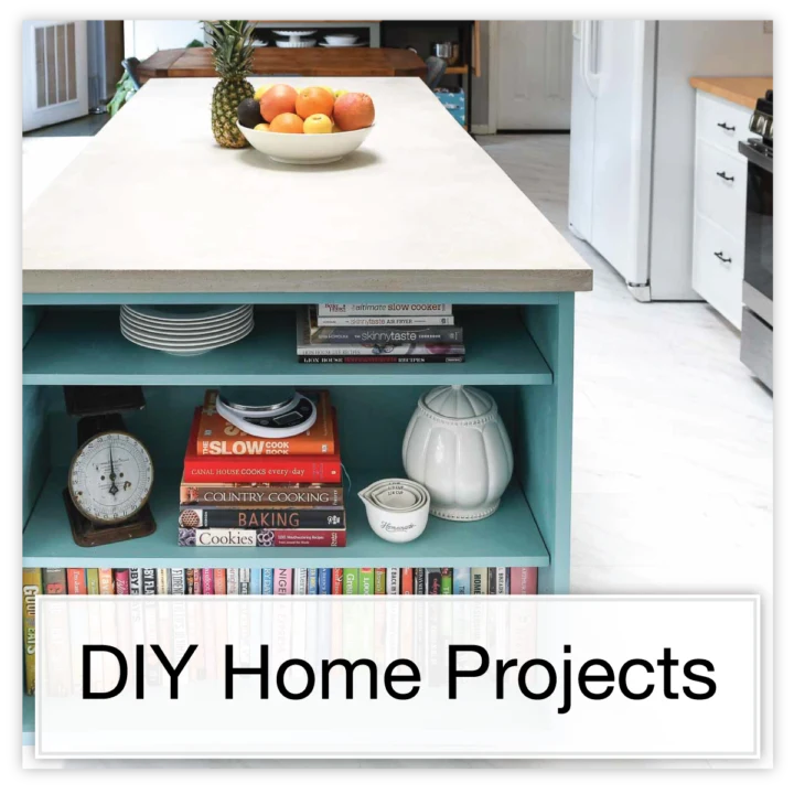 Colorful kitchen island with bookcase on the end and DIY concrete countertop with text button: DIY Home Projects. 