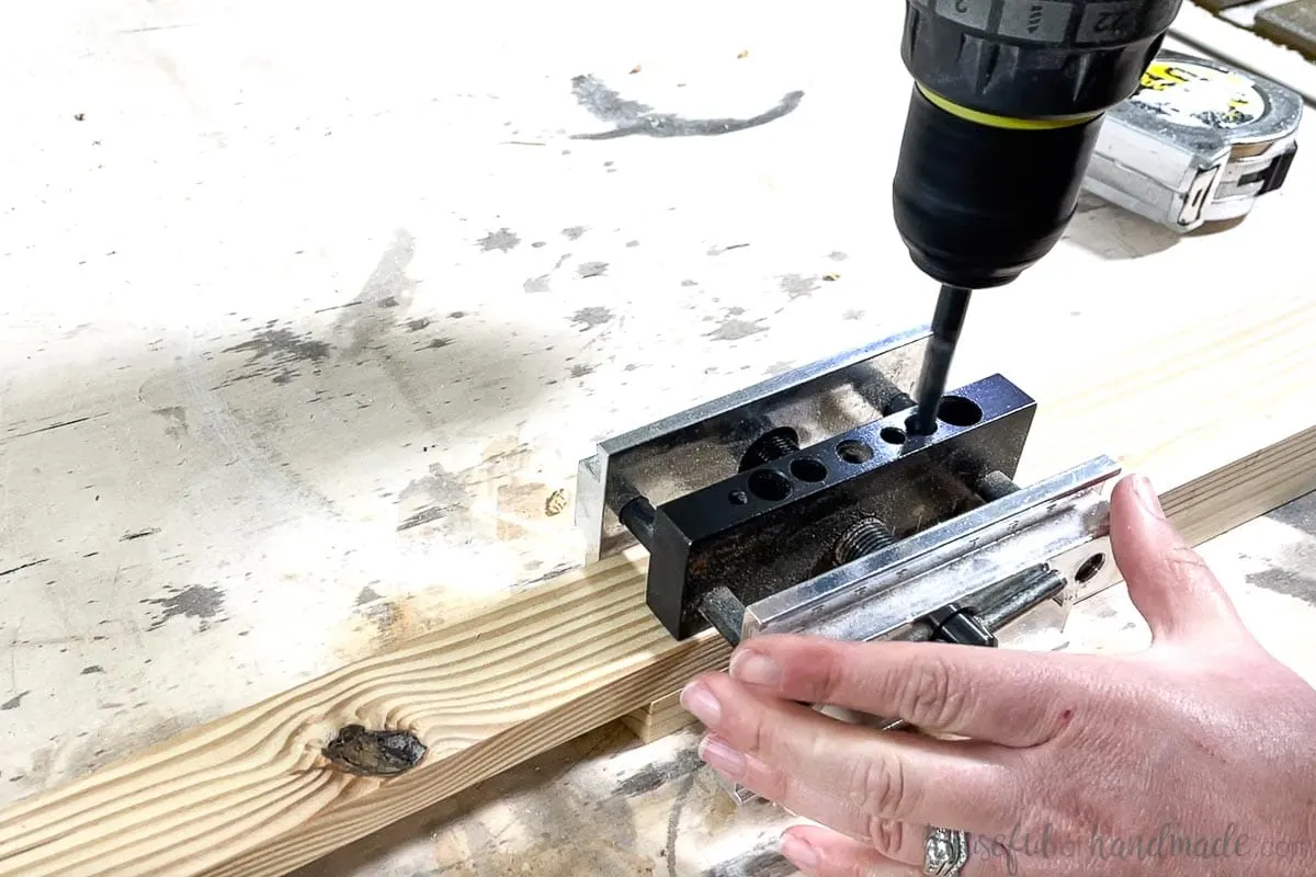 Using the self-centering doweling jig with a scrap piece added to offset the dowel holes. 