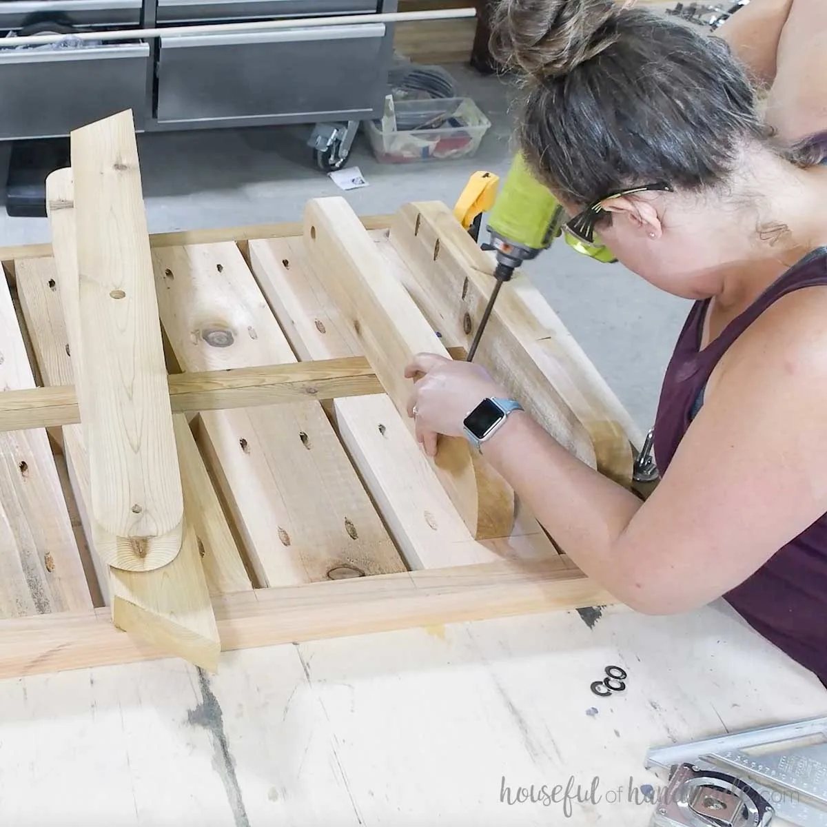 Attaching the top leg pieces to the assembled table tops.