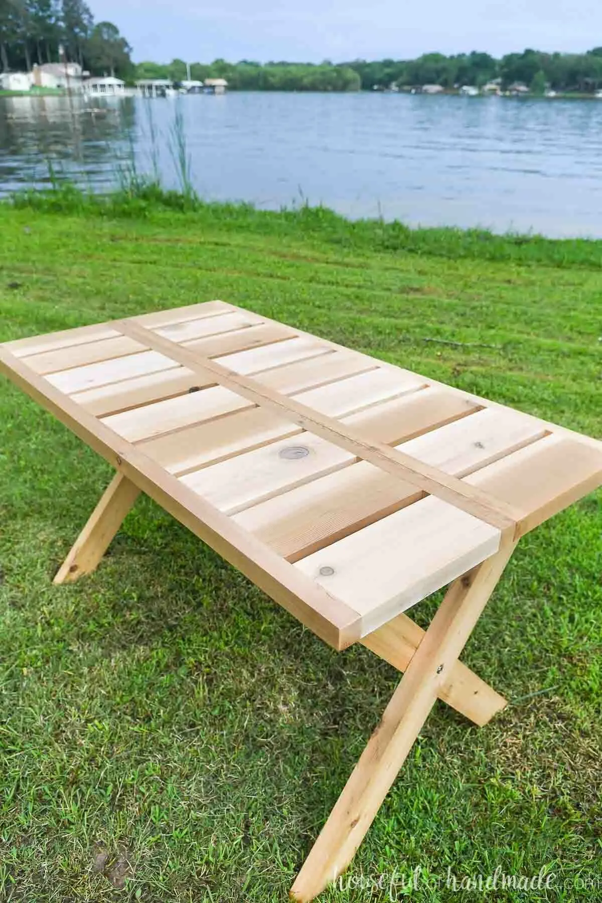 Looking at the top of the wooden folding picnic table made from cedar 2x6 and 2x2 boards. 