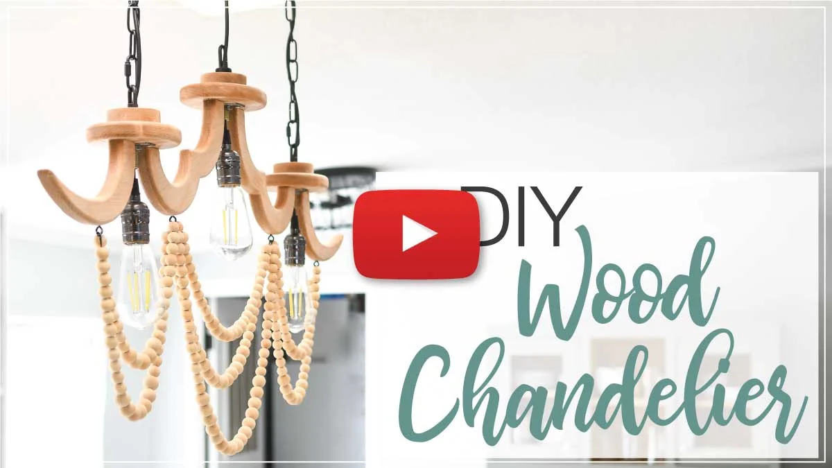 YouTube thumbnail for the DIY wood chandelier video with a red play button on the top.