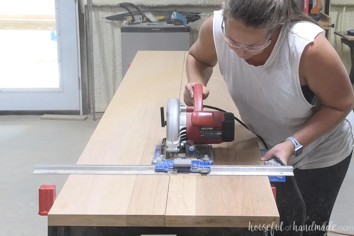 Cutting down the seam between two boards with a circular saw and Kreg RipCut. 