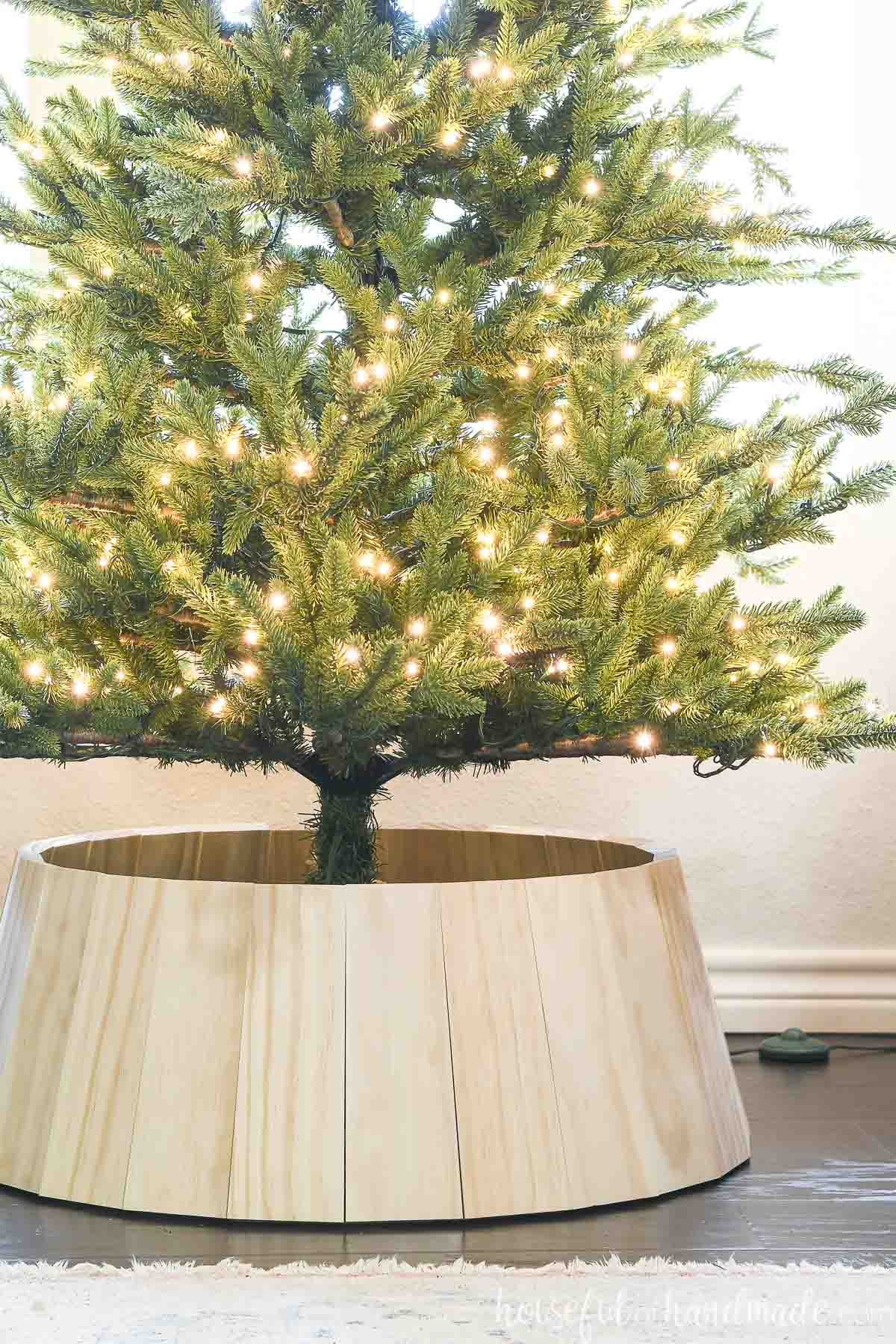 DIY tree collar for a Christmas tree made out of wood.