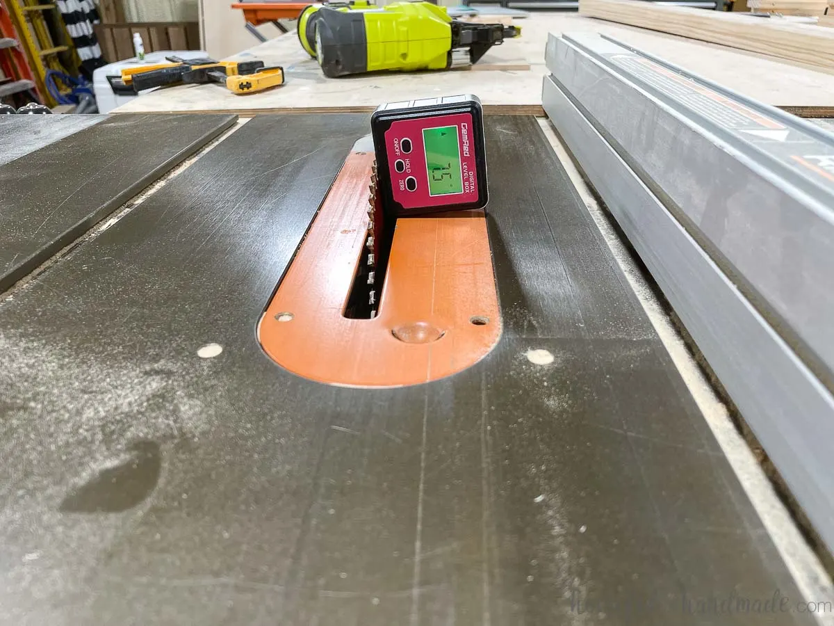 Table saw with a digital angle finder on the blade set to 7.5 degrees. 
