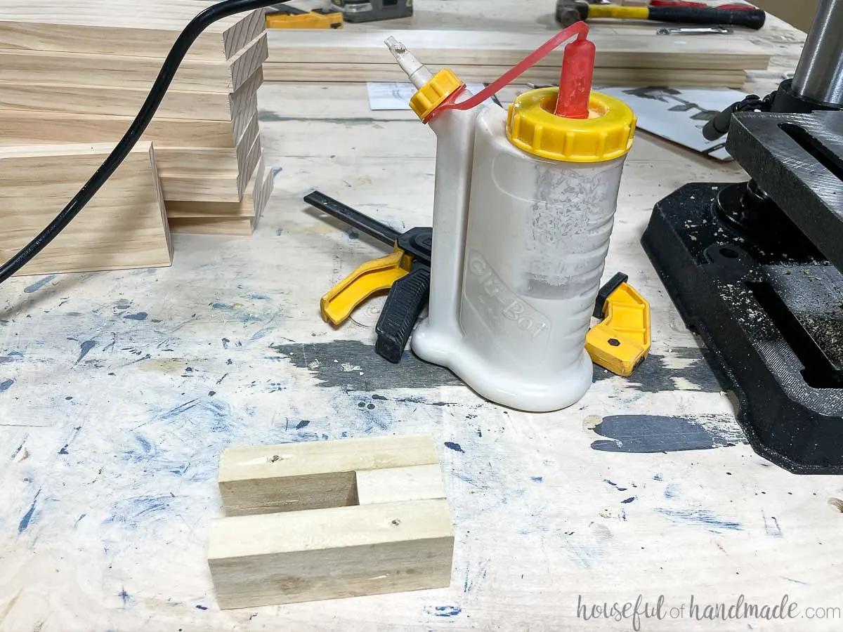 Scraps of wood glued together to make a drill press jig. 