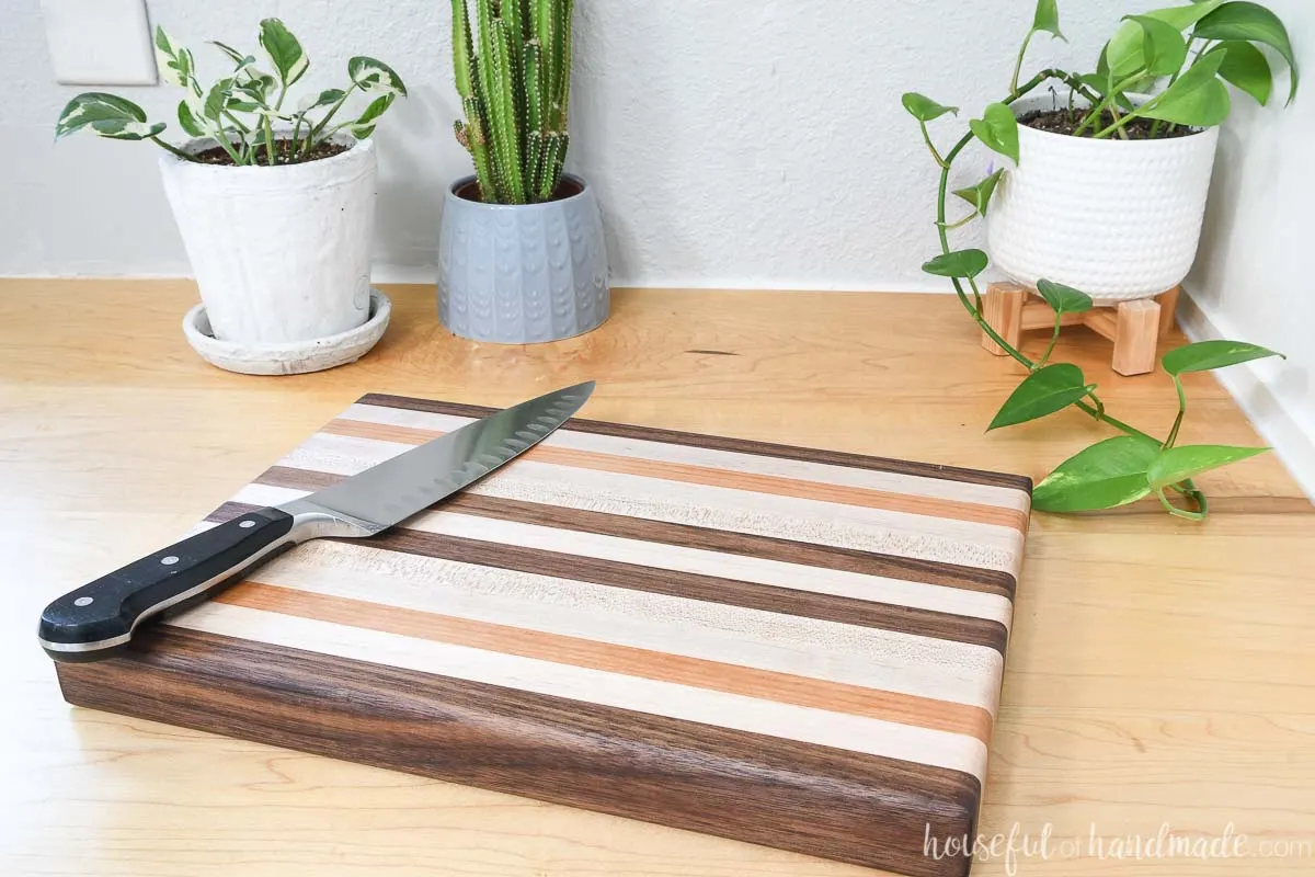 Homemade edge grain cutting board made with basic tools from 1x2 walnut, maple, and cherry boards.