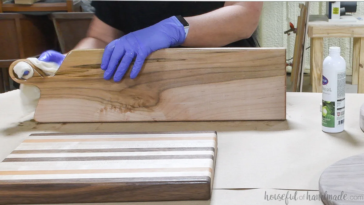 Adding 100% pure tung oil to the DIY breadboard made from maple wood. 