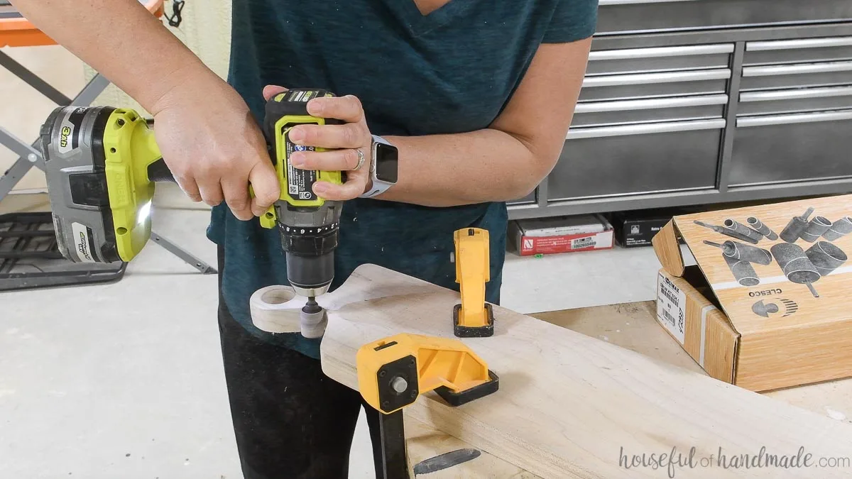 Using a drum sanding bit in a drill to sand the curves in the handle. 