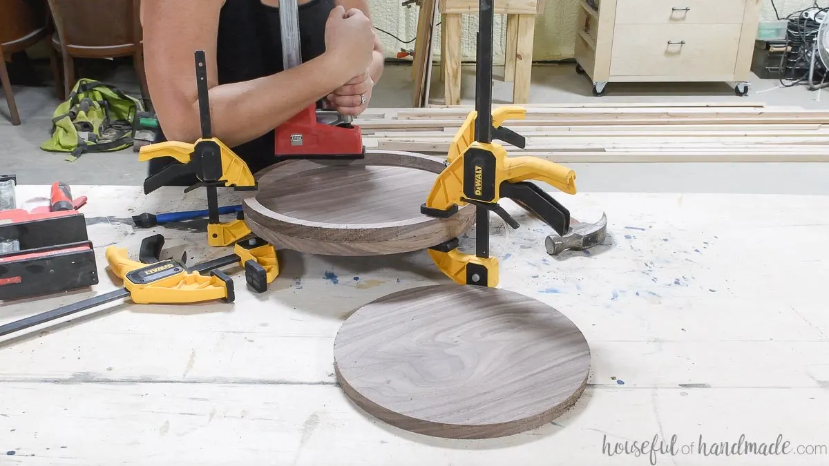 Clamping the two pieces of the DIY round tray together while the glue dries. 