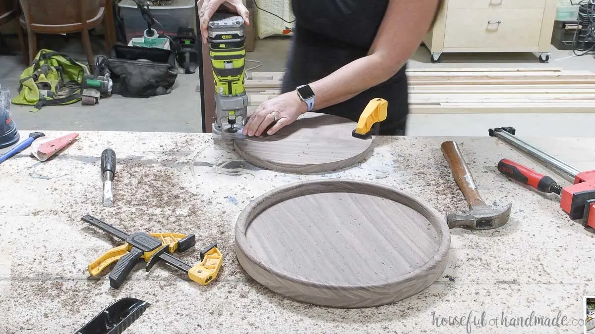 Using a trim router to add a round over to the center cut out left over from making the round tray. 