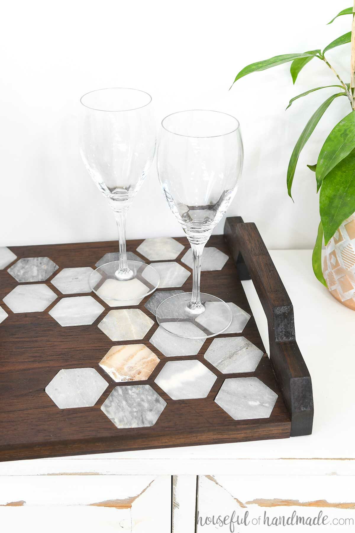 Close up of the marble tiles inlaid into a walnut serving tray. 