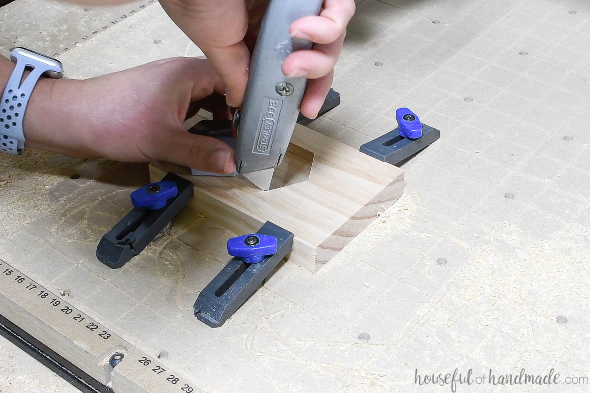 Cleaning up the edges of the inlay pocket with a utility knife.