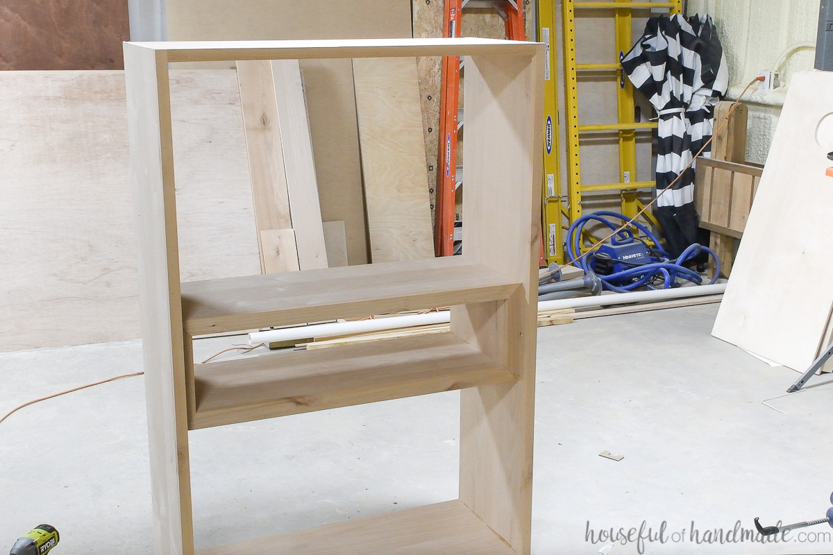 Completed cabinet box with display cubby inside but no back. 