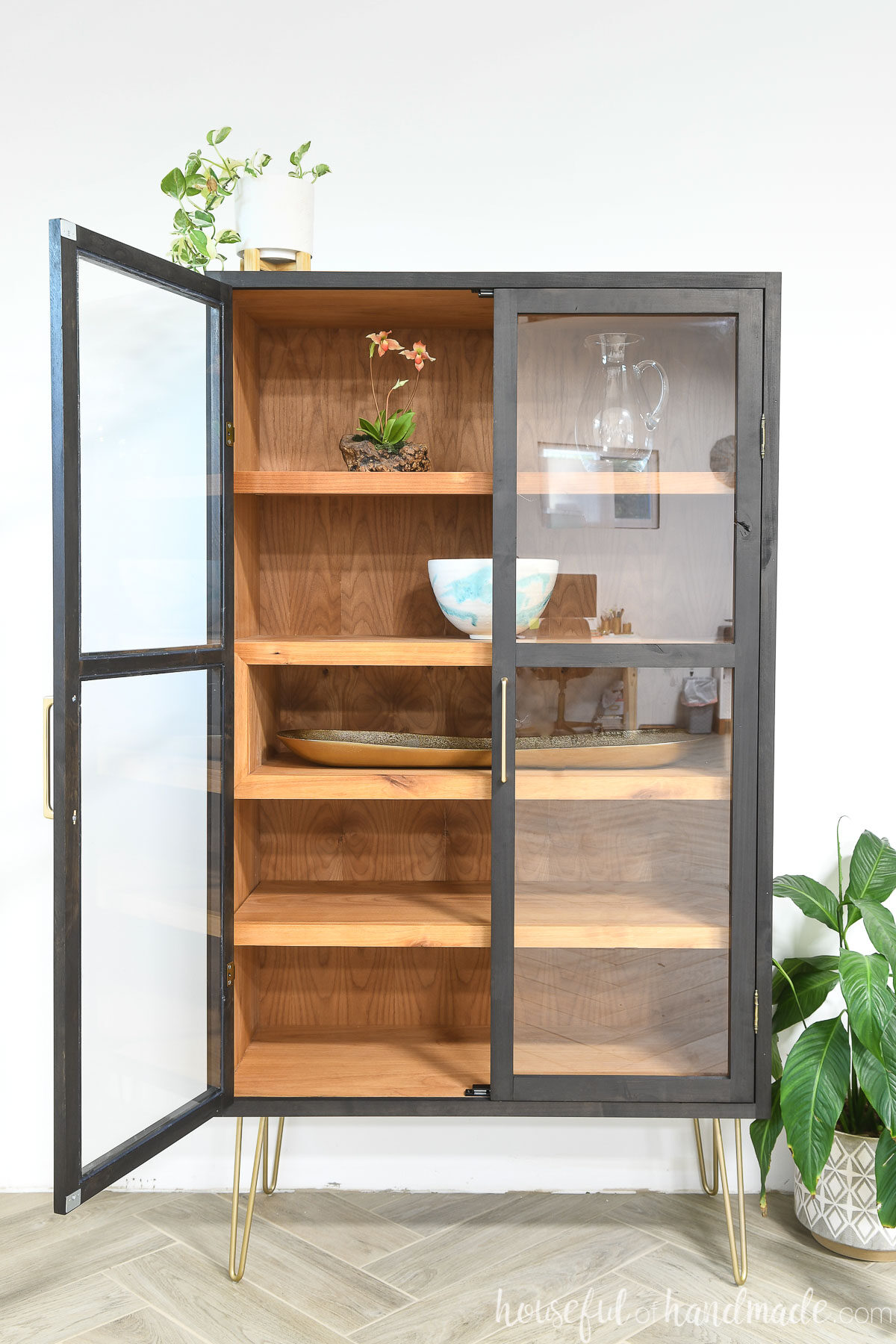 DIY modern display cabinet with two panel glass doors, one open showing the shelves inside.