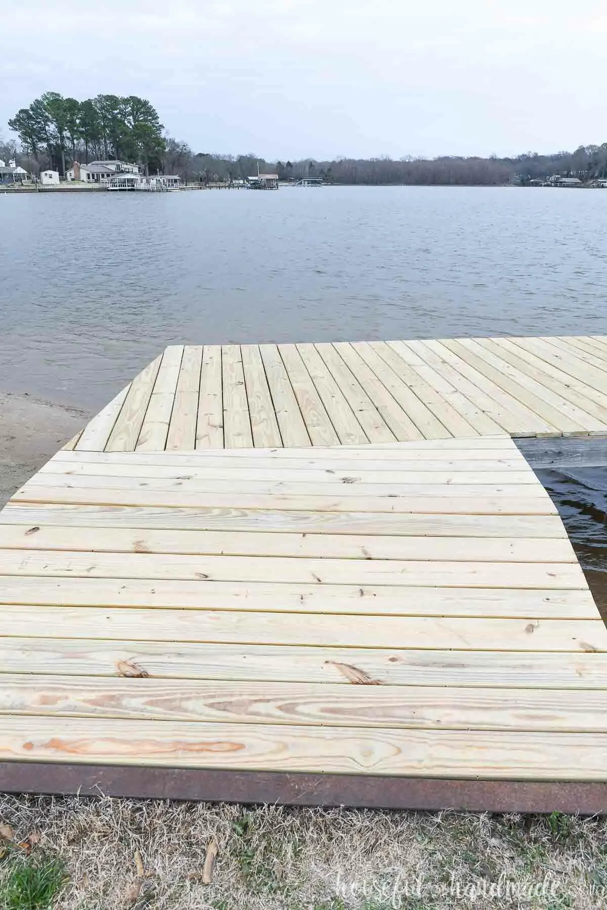 The ramp of the dock with angled cut boards. 