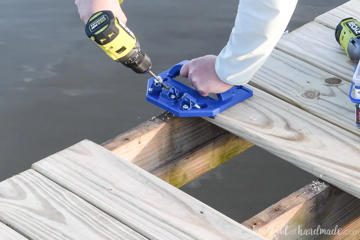 Attaching a deck board on the edge of the deck with a Deck jig.