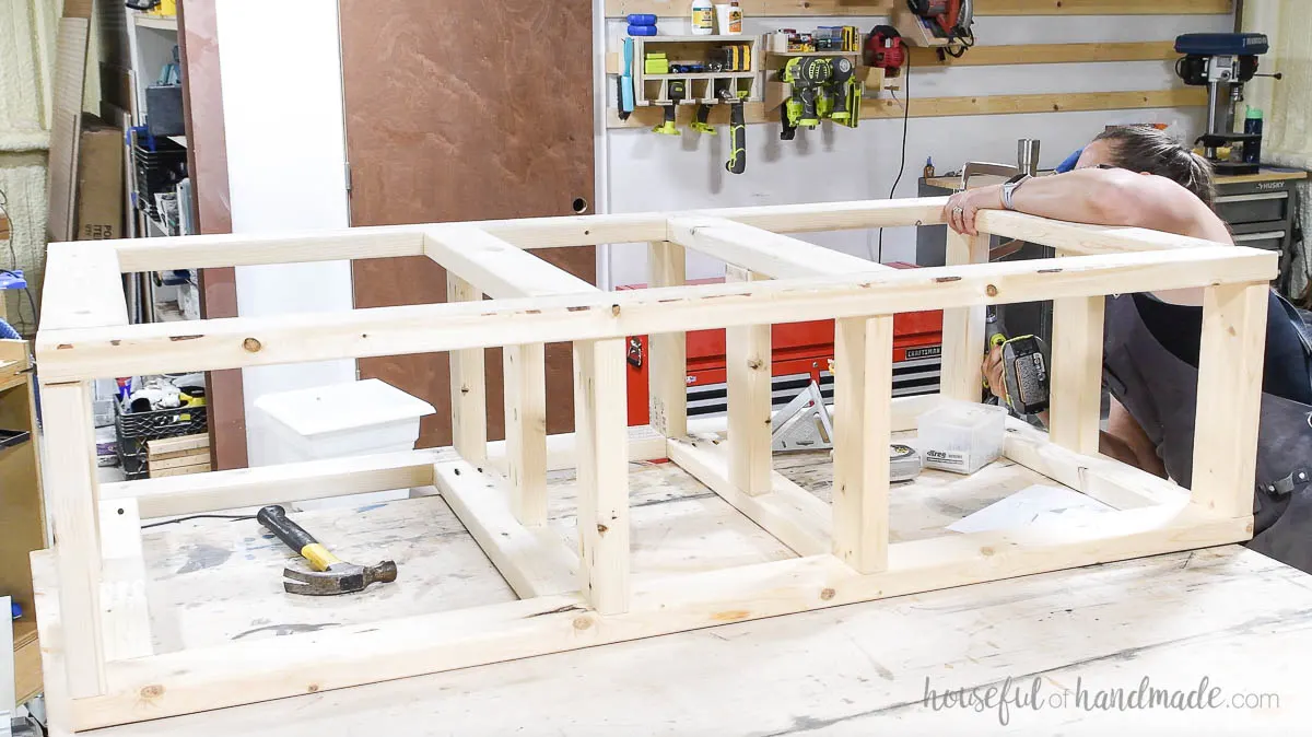 Attaching the top to the washer and dryer platform frame. 