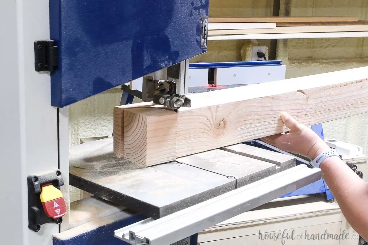 Cutting the circle on the top post with a bandsaw. 