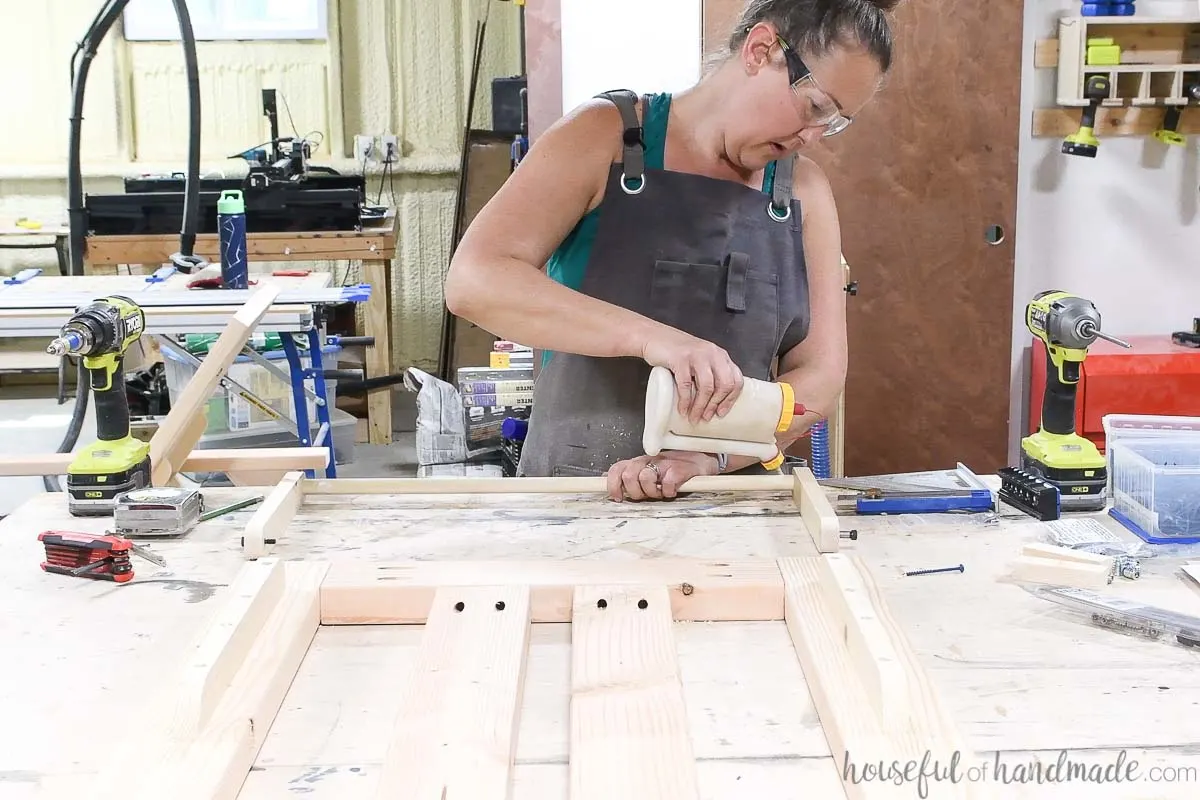 Glueing a dowel into the holes on the curved boards. 