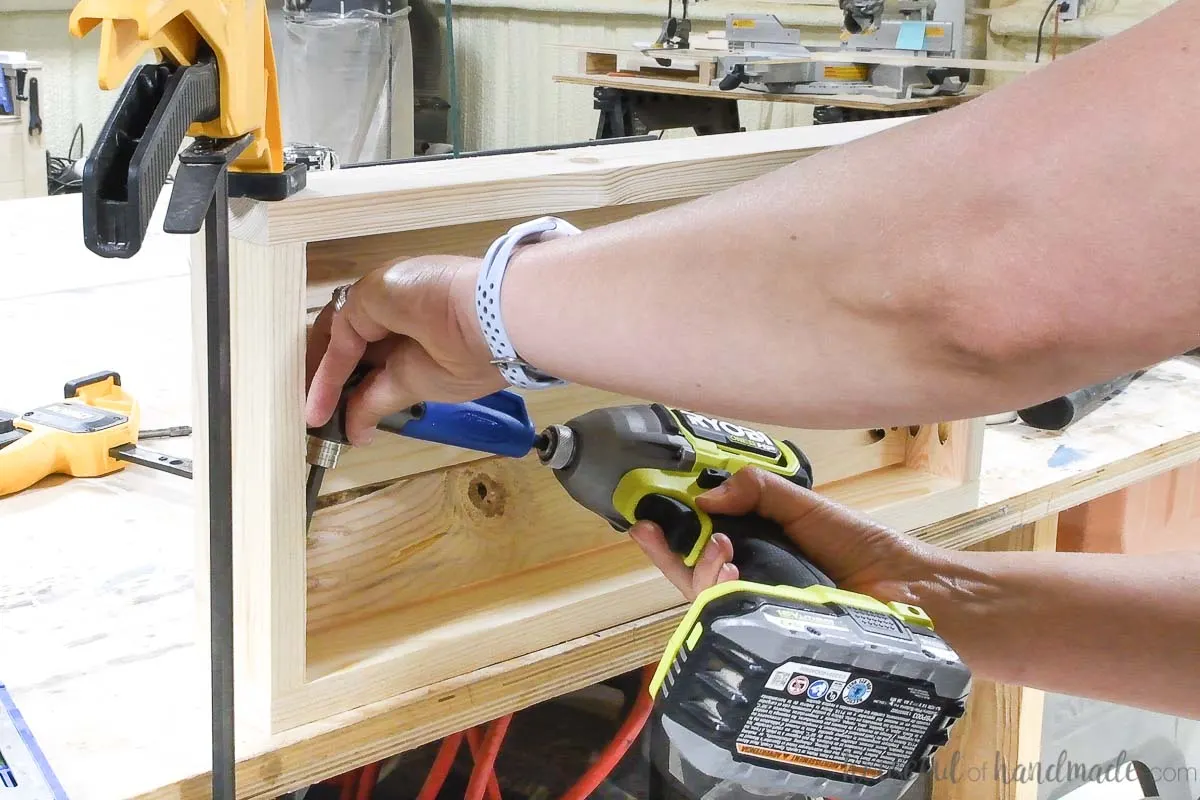 Attaching the front of a planter frame with a 90 degree angle bit. 