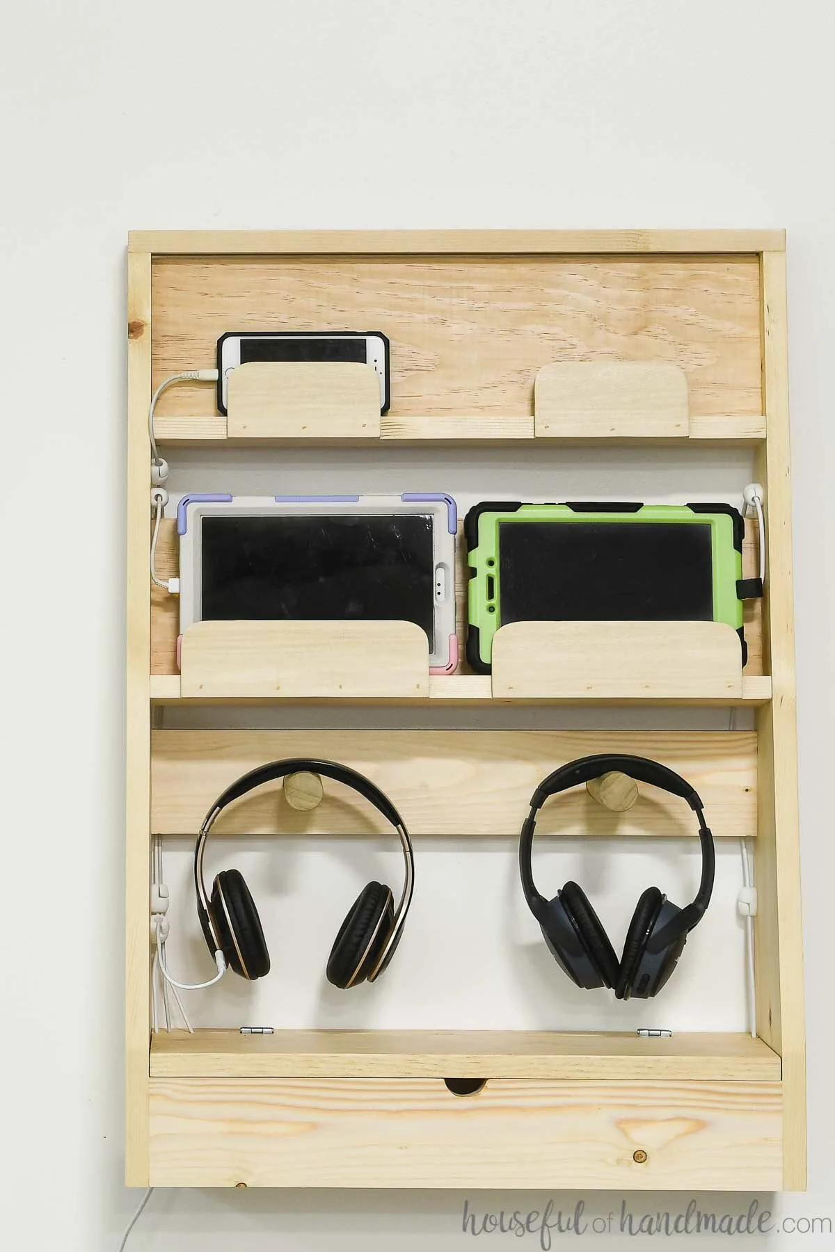 Family charging station for phones, tablets and headphones hanging on a wall. 