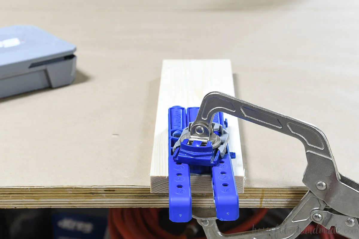 Kreg 320 jig clamped to a piece of 1x4 material with an automaxx clamp. 