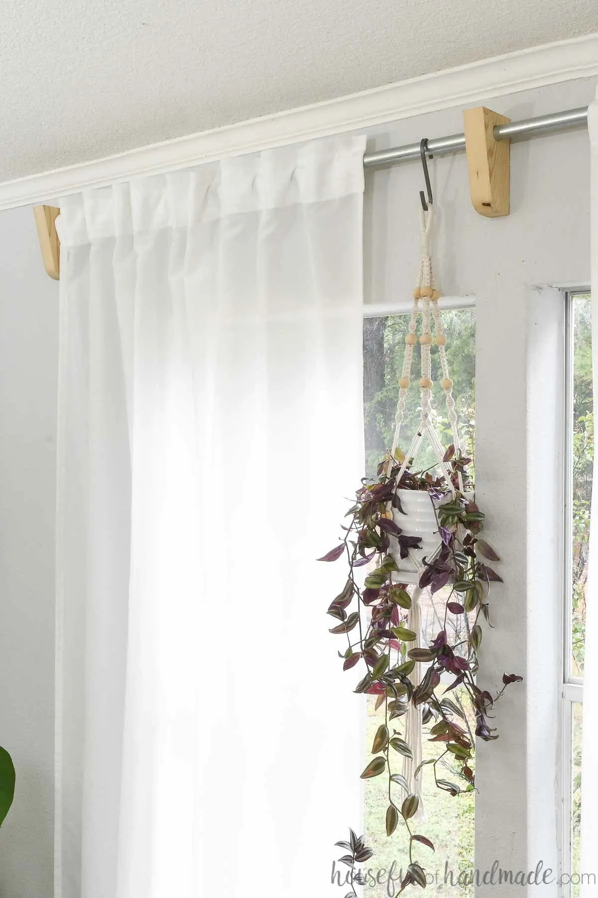 Where should curtain rod brackets be placed?