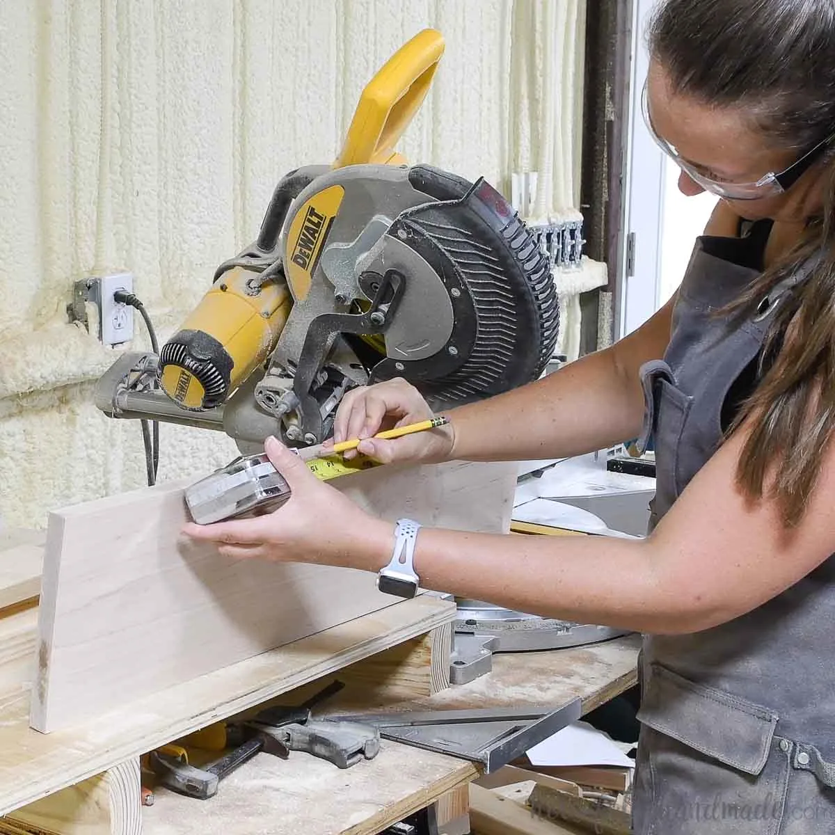 Measuring the 1x8 board for the second cut. 