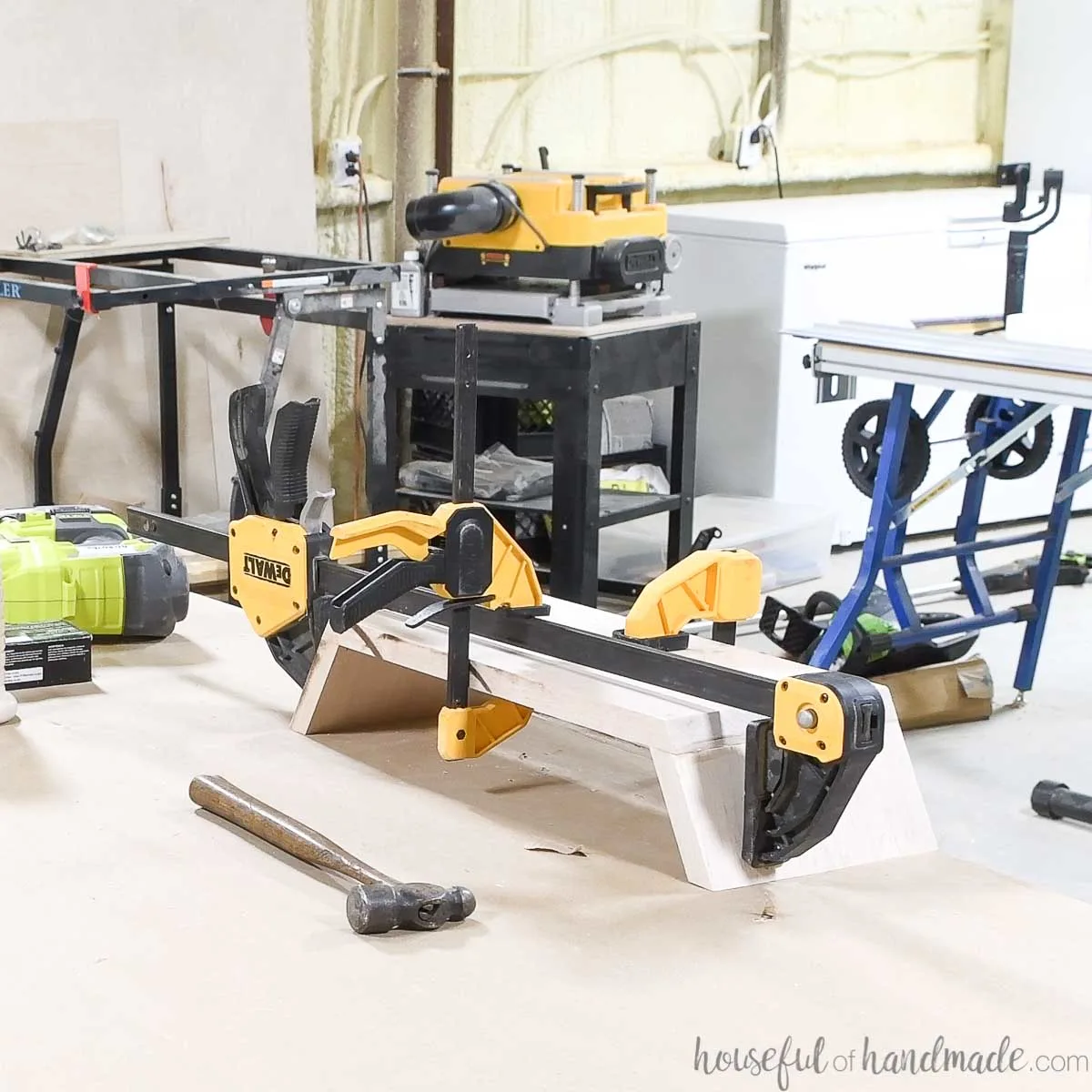 Using 3 clamps to hold the monitor stand together while the glue dries. 