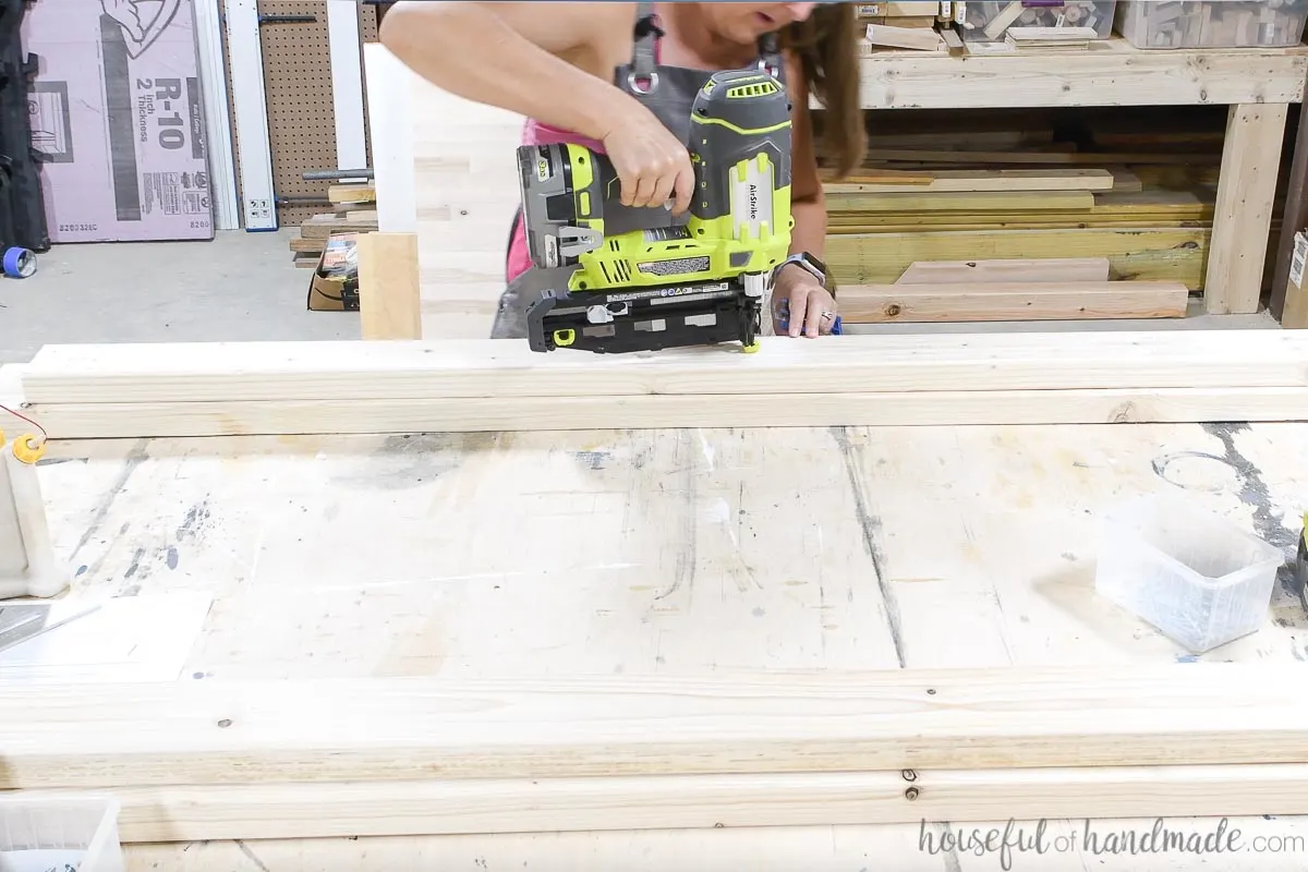 Attaching the rail support to the bed rails with finish nails before adding screws. 